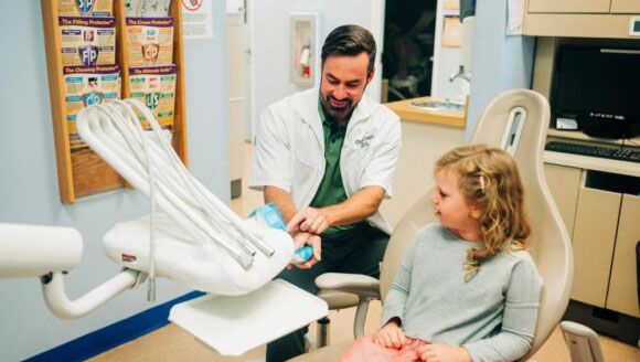 CDP's Dr. Evans chairside with young patient.