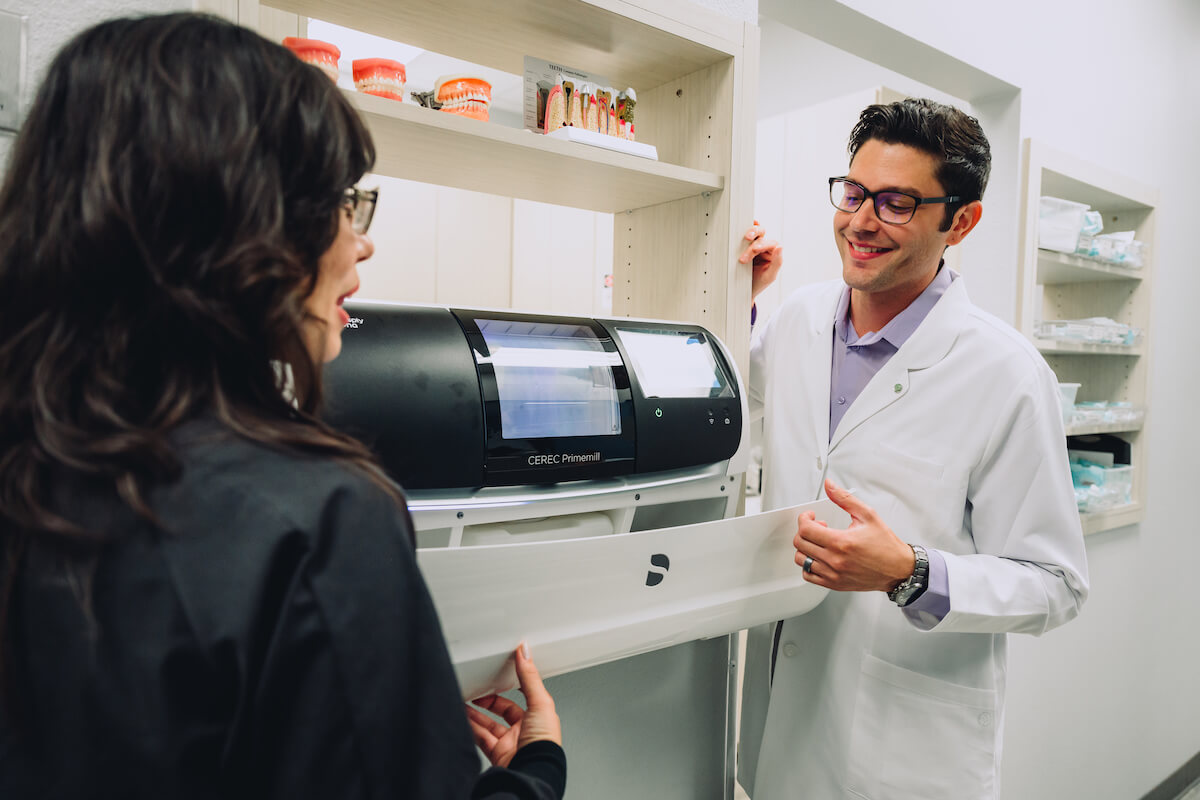 A new dentist receives advanced dental training from his mentor at a CDP practice.