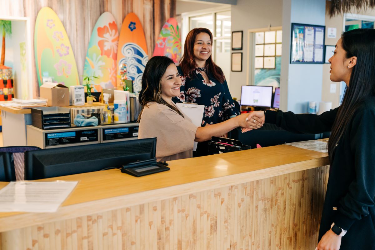 Smile Magic Lewisville Front Desk Staff welcome interviewee.