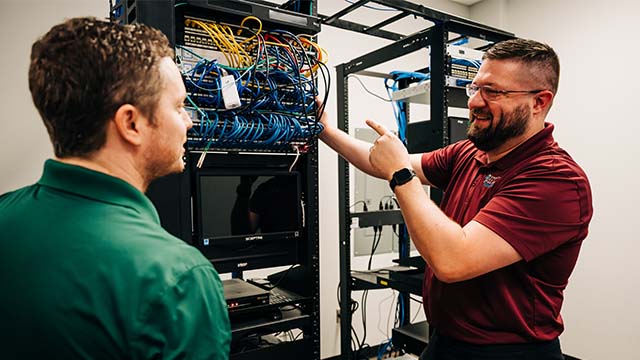 CDP IT staff working on equipment.