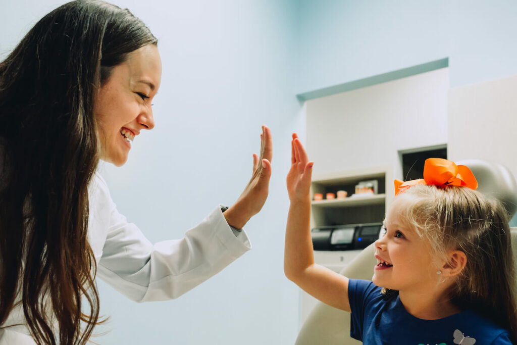 CDP dentist giving young patient a high-five. At the end of the day, dentistry is about serving your patients. 