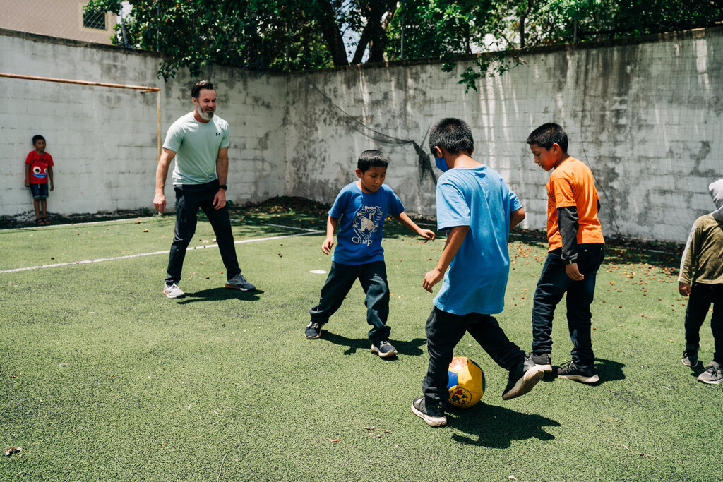 Young children playing soccer in Mexico on a Dental Mission Trip.