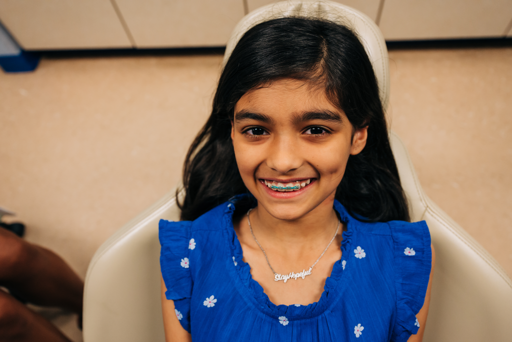 Smiling ortho patient with braces.